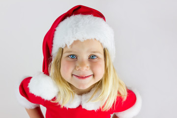 Portrait of a beautiful girl in a red new year cap