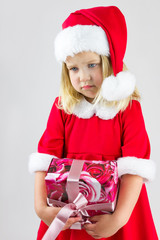 Portrait of a girl in a red new year cap