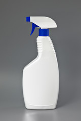White detergent plastic spray bottle Isolated on gray