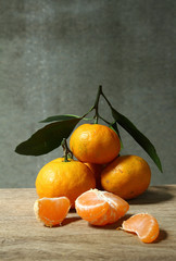 Still life with orange fruites on wooden table