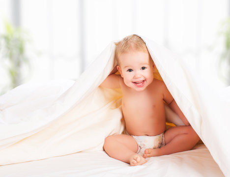Happy Baby Under A Blanket Laughing