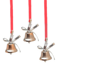 three silver bells on red ribbons