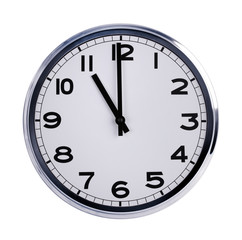 Round office clock shows eleven o'clock