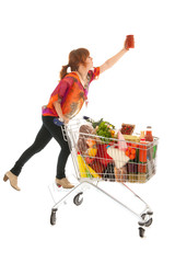 Woman with Shopping cart picking food from high cupboard