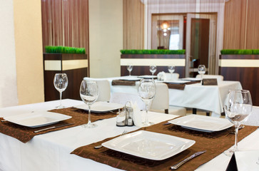 Fototapeta na wymiar Tables set for meal