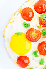 Fried eggs with cherry tomatoes