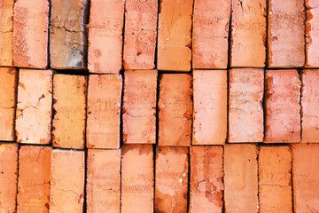 Orange old bricks layered on top of each other