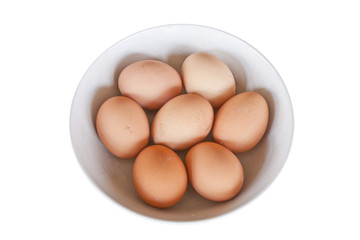 Eggs in the bowl on white background.