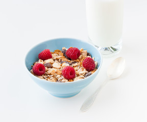 Bowl of healthy muesli with fresh raspberries