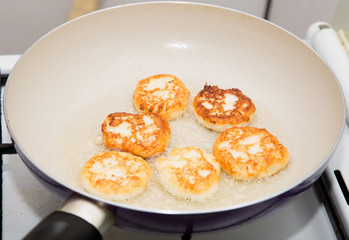 pancakes are fried in a pan
