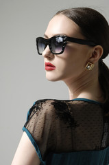 Young woman wearing the modern sunglasses