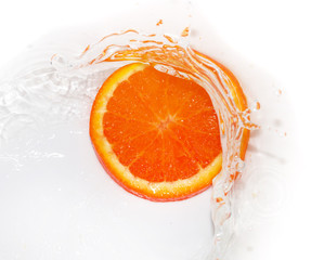 Fototapeta na wymiar orange in water on white background