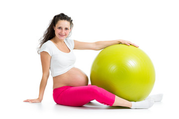 Fototapeta na wymiar Pregnant woman excercises with fitness ball