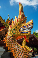 Dragon guard statue at the buddhist temple entrance in Thailand