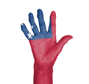 Palm of a woman hand, painted with flag