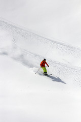 Skier in deep powder, extreme freeride