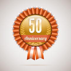 Anniversary golden badge with ribbons