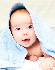Infant under towel