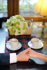 Two Hands on Table