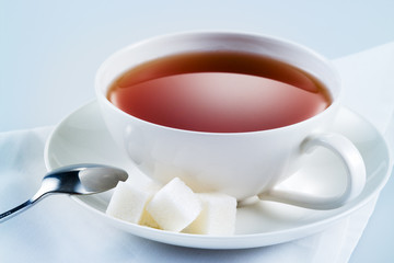 Black tea with sugar cubes