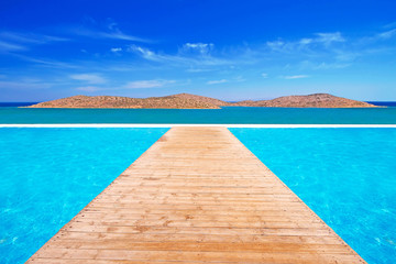 Fototapeta premium Quay on the turquise water of Mirabello bay in Greece
