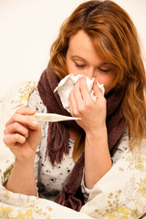 woman checking feaver with digital termomether girl with flu