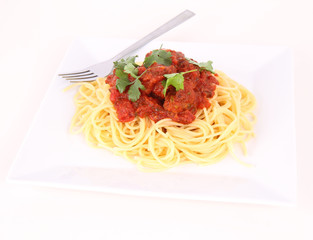 Pasta with meatballs decorated with coriander