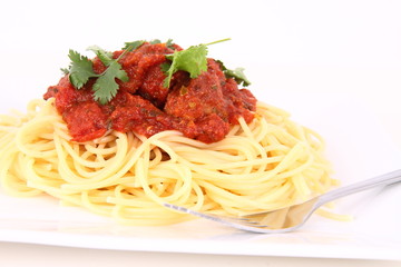 Pasta with meatballs decorated with coriander