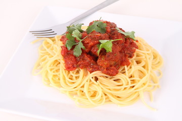 Pasta with meatballs decorated with coriander