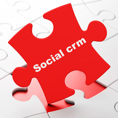 Finance concept: Social CRM on puzzle background