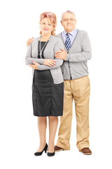 Full length portrait of a middle aged couple posing
