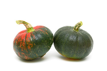 two mature pumpkins close-up on white background.