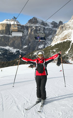The woman stands on mountains slope.