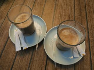 In two cups of cappuccino