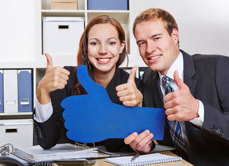 Business people holding many thumbs up