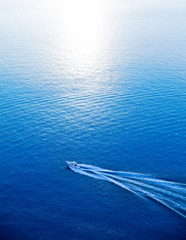 Naklejka premium Boat cruising blue Mediterranean sea aerial view