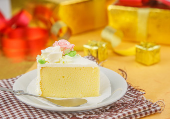 Cake on dish against golden background