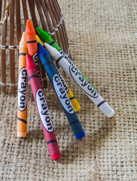 set of crayons on brown background