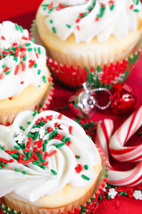 Holiday cupcakes with vanilla frosting, red and green sprinkles