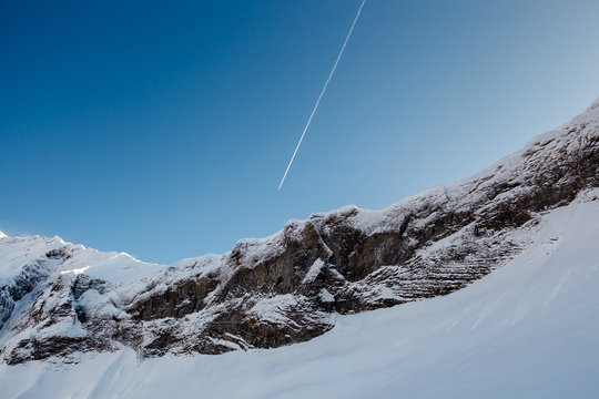 Mountain Peak and Airplane Trail near Megeve in French Alps, Fra