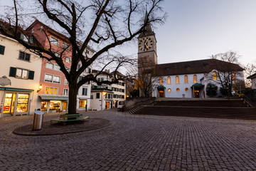 Fototapeta premium Illuminated Saint Peter Church in the Evening, Zurich, Switzerla