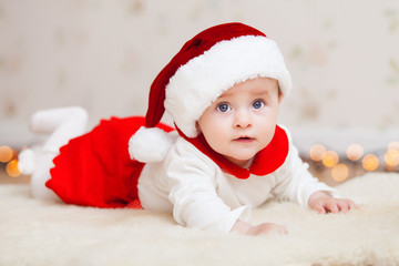 Cute baby in suit of Santa's little helper