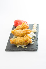 fried chicken fillet with vegetables isolated