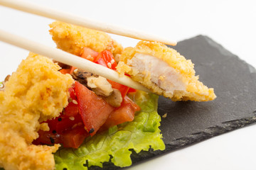 fried chicken fillet with vegetables isolated