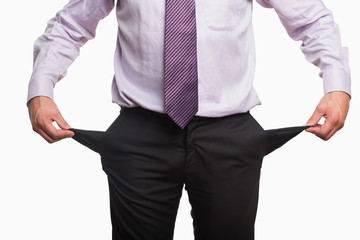 Mid section of a businessman with pockets pulled out