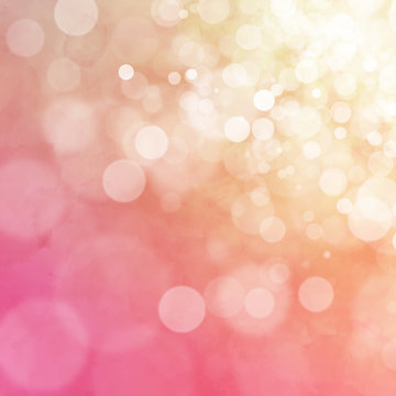 White bokeh on orange and pink watercolor background