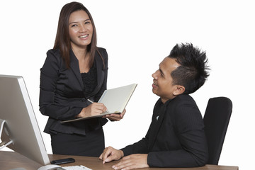 Business partners working at the office on a computer