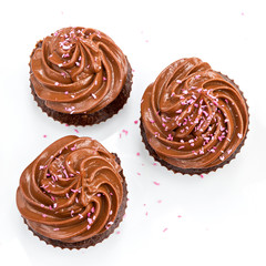 Chocolate cupcakes with pink coconut sprinkles