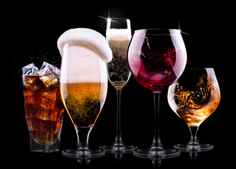 set with different drinks on black background