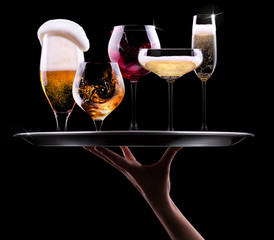 set with different drinks on black background